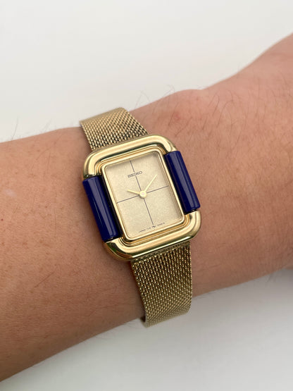 Seiko Hidden Crown 1719-3070 vintage ladies' watch worn on the wrist showing its sleek gold and blue design.