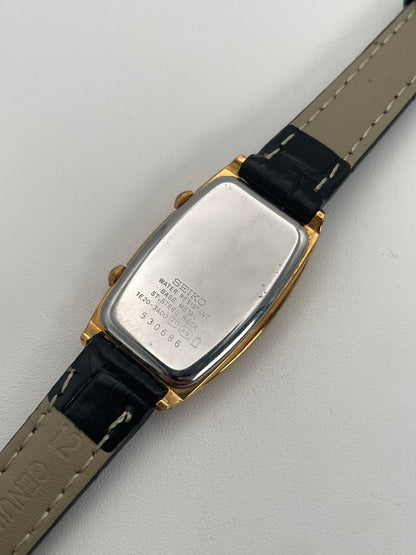 Caseback view of Seiko Noie Dual Time watch showcasing stainless steel back with engraved details, black leather strap.