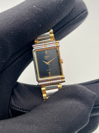 Close-up of the Seiko Porte watch displaying the bamboo-style bezel and minimalist black dial
