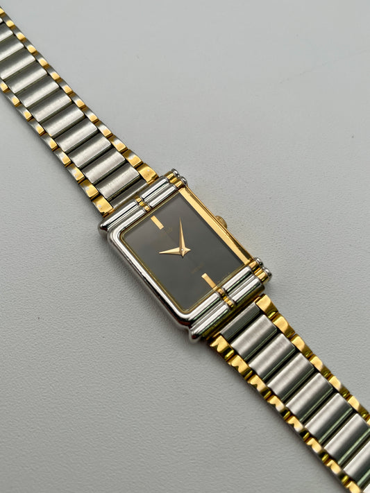 Front view of the Seiko Porte 2P20-5400 Vintage Women's Watch in a two-tone rectangular case with black dial and bracelet
