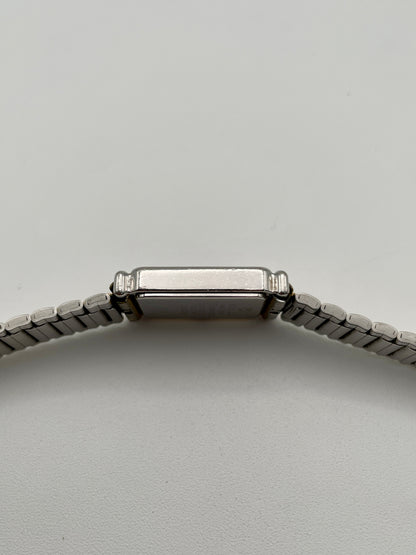 Side profile view showing the smooth curvature of the watch case
