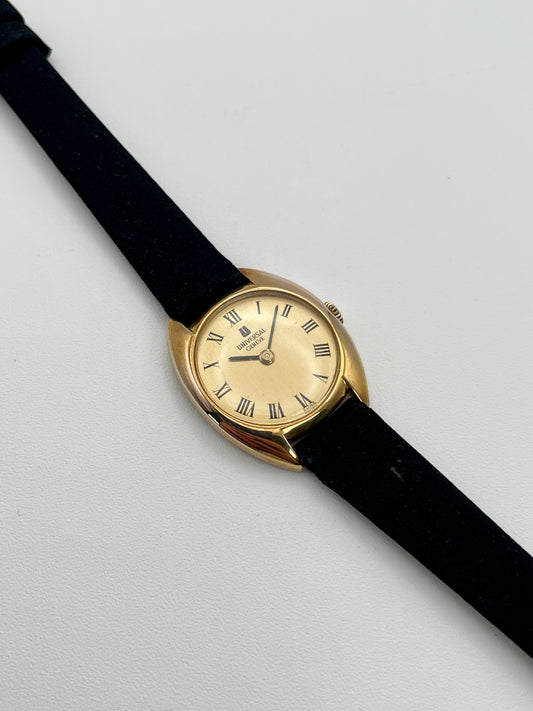 Main view of the Universal Geneve cushion vintage women's watch in gold with black strap
