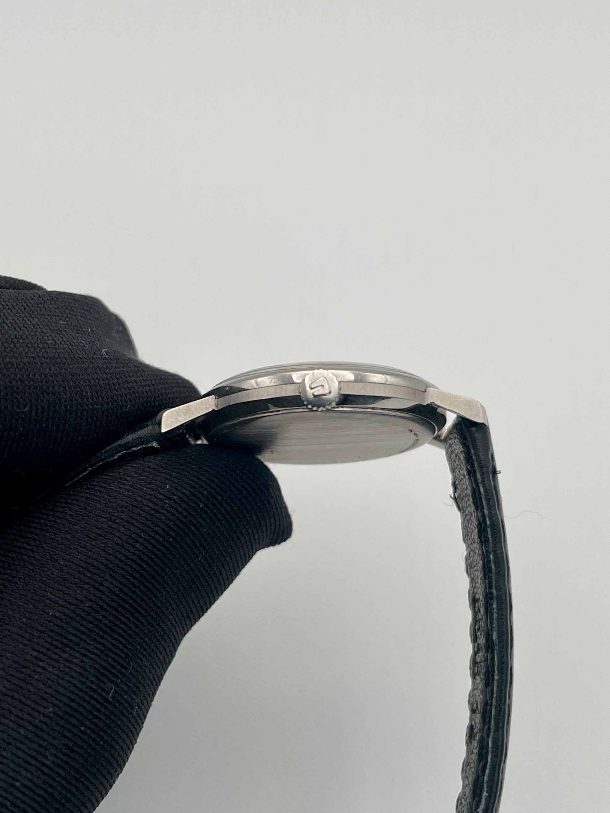 Close-up view of the Universal Geneve Ultra Thin watch crown side with visible crown detail