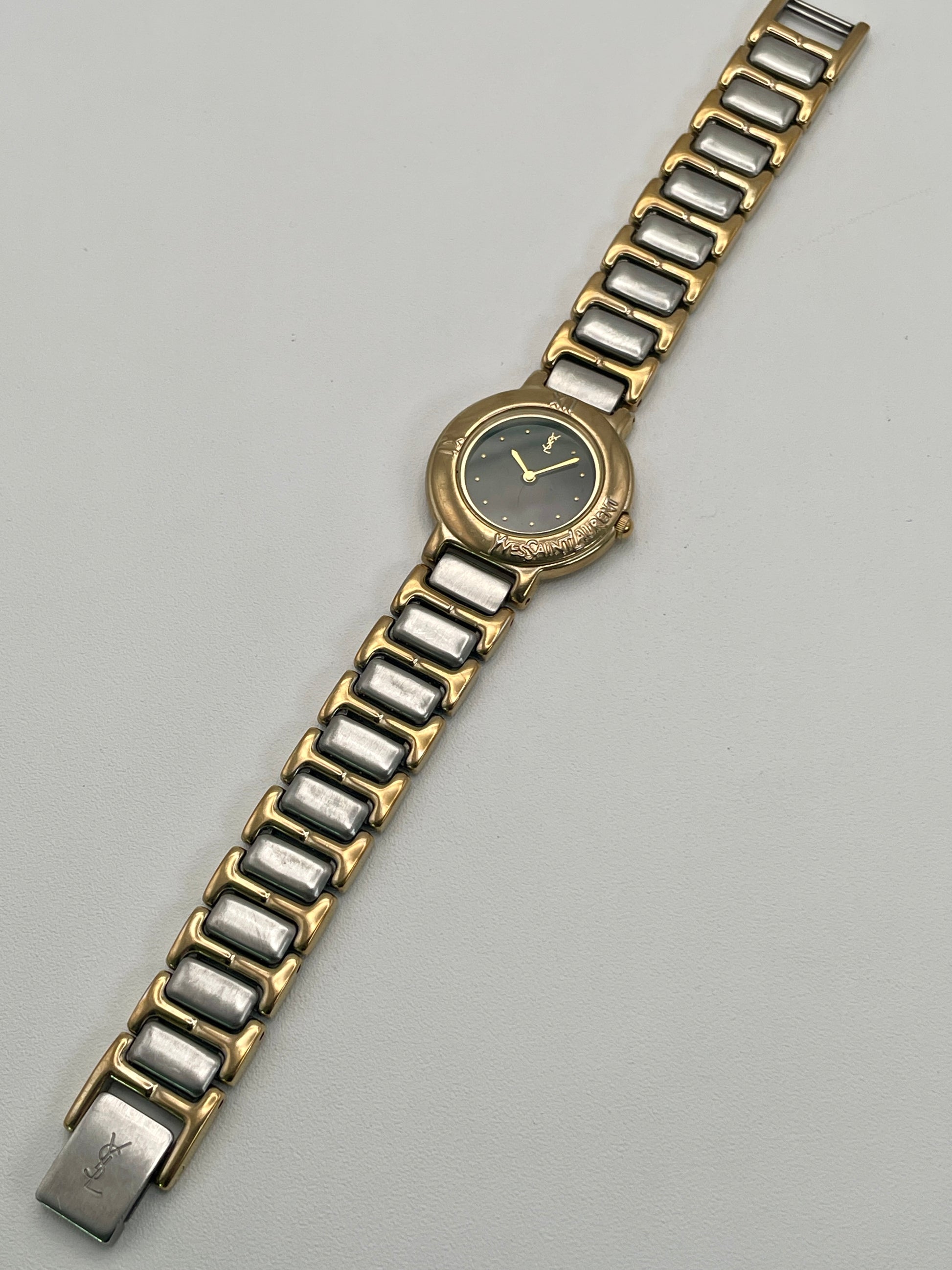 Full front view of the YSL Black Pour Femme vintage watch with dial, case, and bracelet clearly shown.