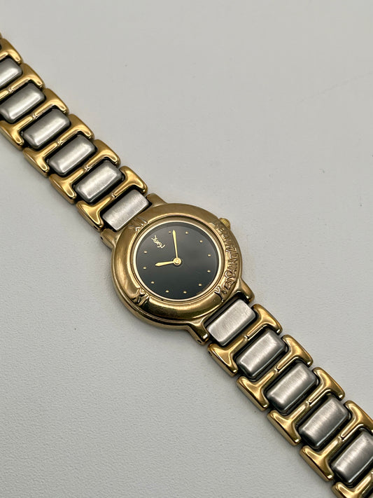 Yves Saint Laurent Black Pour Femme vintage women's watch in a gold case with two-tone bracelet, shown with original box and extra links.