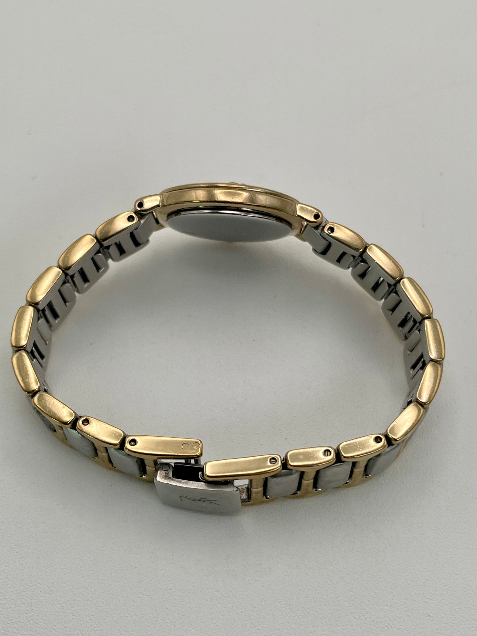 Side view of the YSL watch showing the slim case profile.