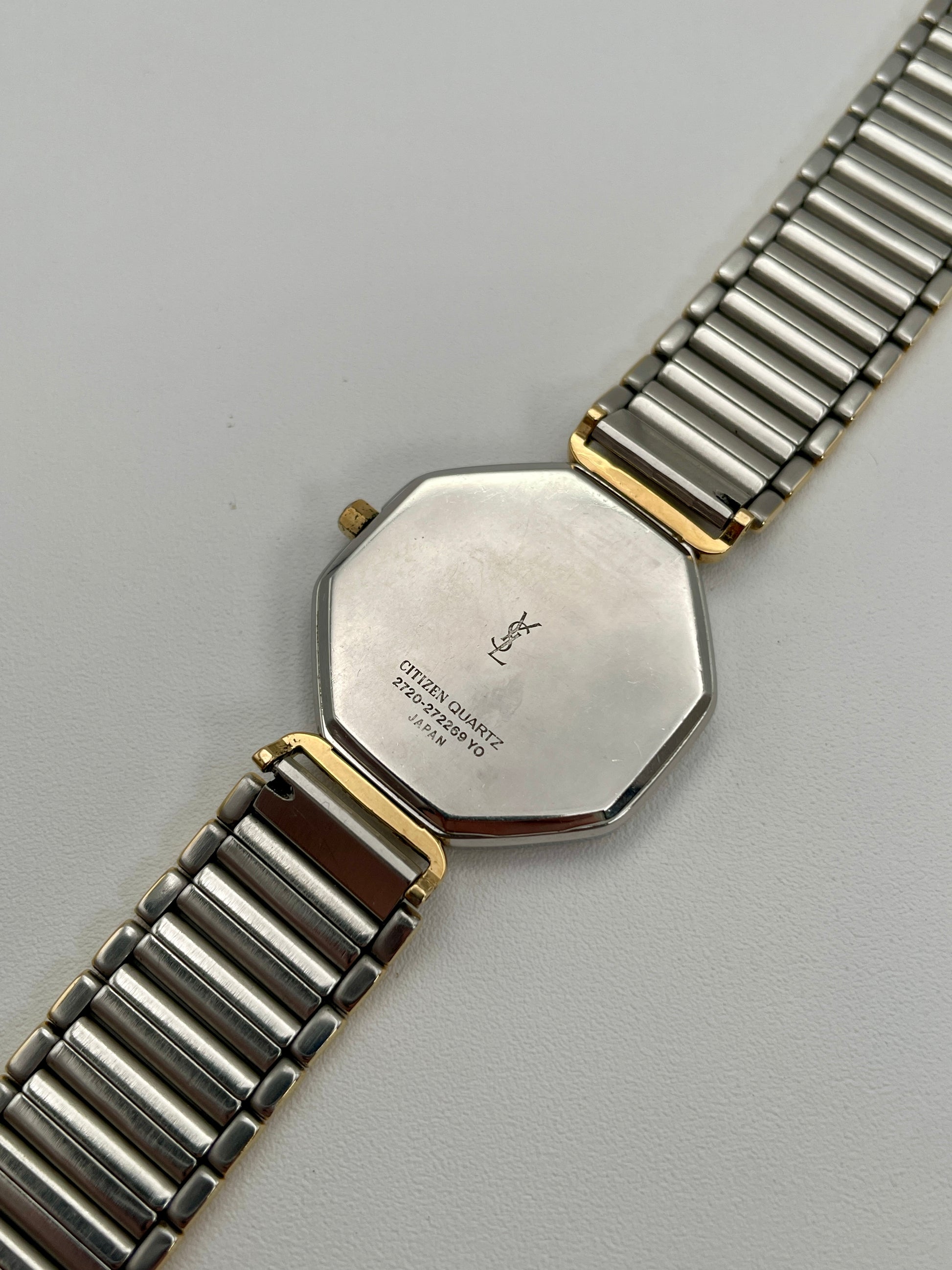 Caseback of Yves Saint Laurent octagon watch showing Citizen Quartz Japan markings

