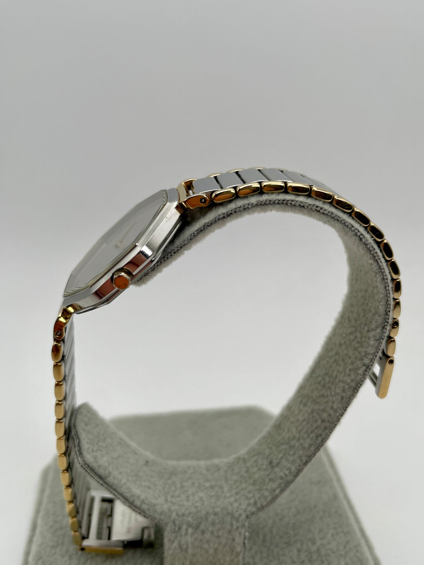 Reverse side view of the YSL octagonal watch highlighting gold bezel and crown
