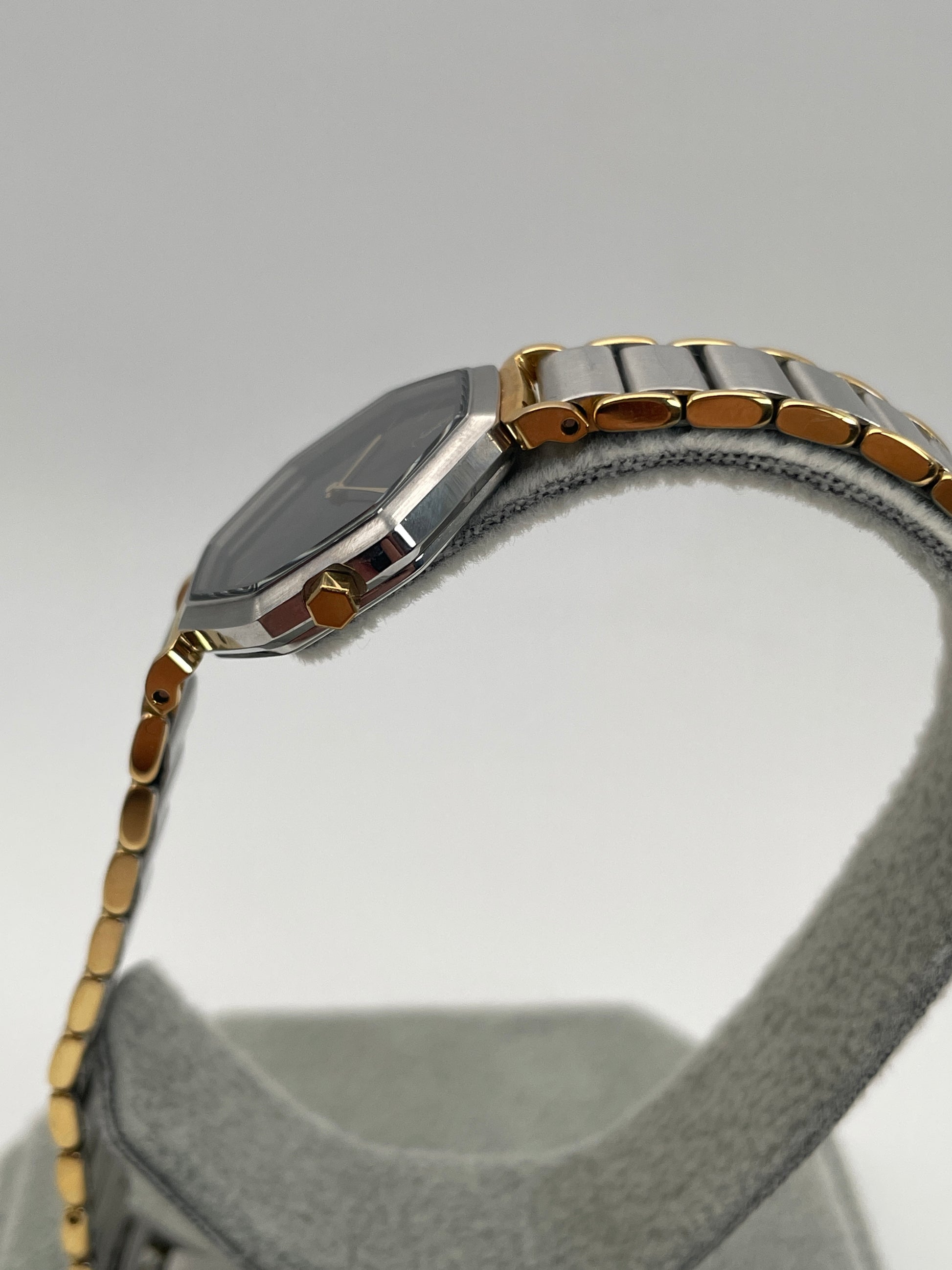 Detailed crown side view of the Yves Saint Laurent Octagon Vintage Women's Watch with a gold-tone crown.