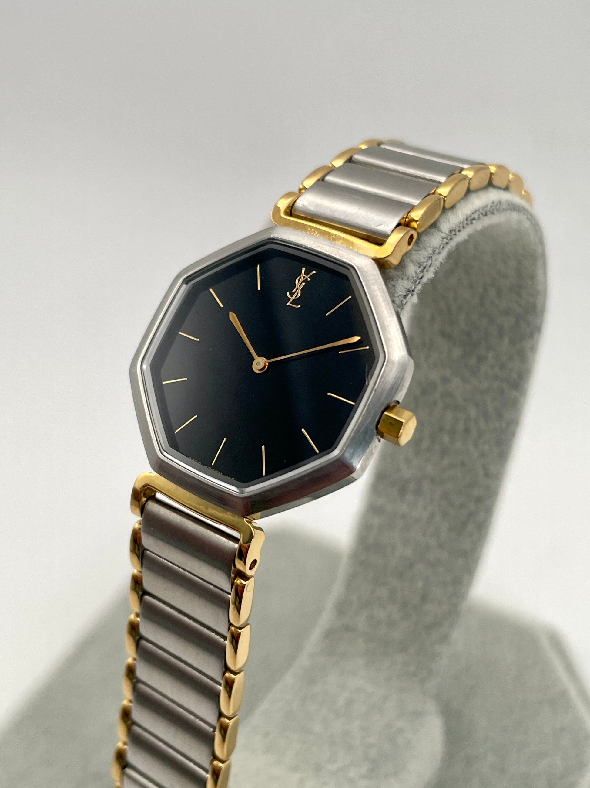 Side angle of the Yves Saint Laurent Octagon Vintage Women's Watch showcasing its sleek octagonal design and gold-tone accents.