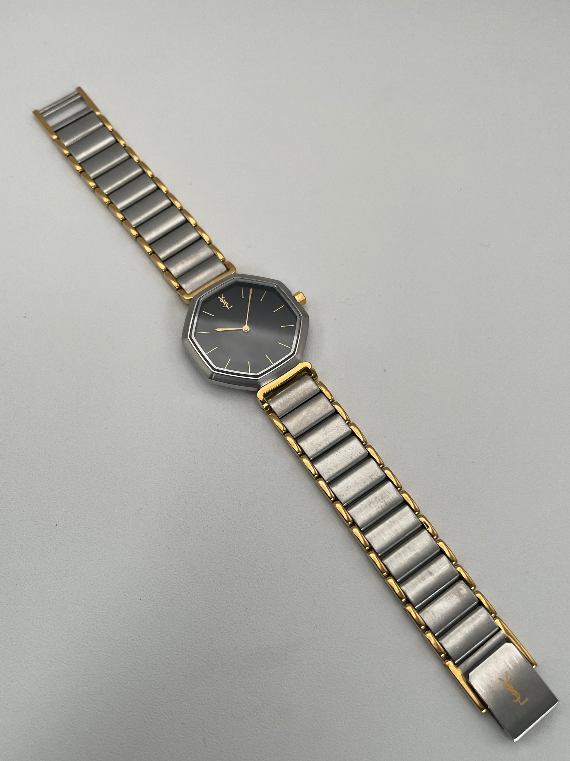 Full layout of the Yves Saint Laurent Octagon Vintage Women's Watch, highlighting its two-tone bracelet and octagonal case.