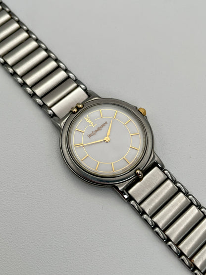 Vintage Yves Saint Laurent two-tone watch featuring a stainless steel and gilt case with a matching bracelet.