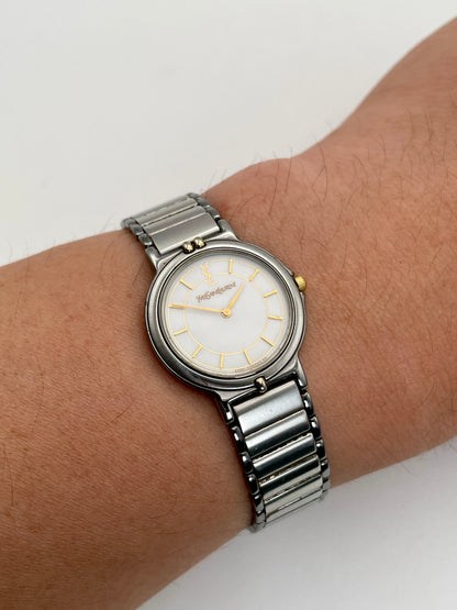 Vintage Yves Saint Laurent two-tone watch worn on wrist, showcasing the stainless steel and gilt case with a matching bracelet.