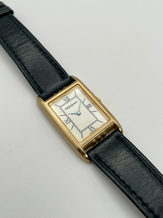 Front view of Yves Saint Laurent Tank Vintage Women's Watch in gold with black strap

