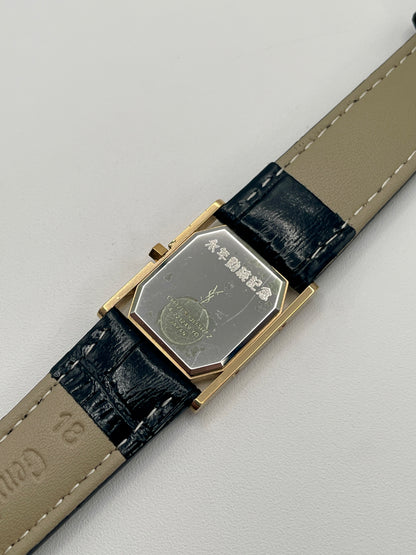 Stainless steel caseback with YSL branding and engraved Japanese markings