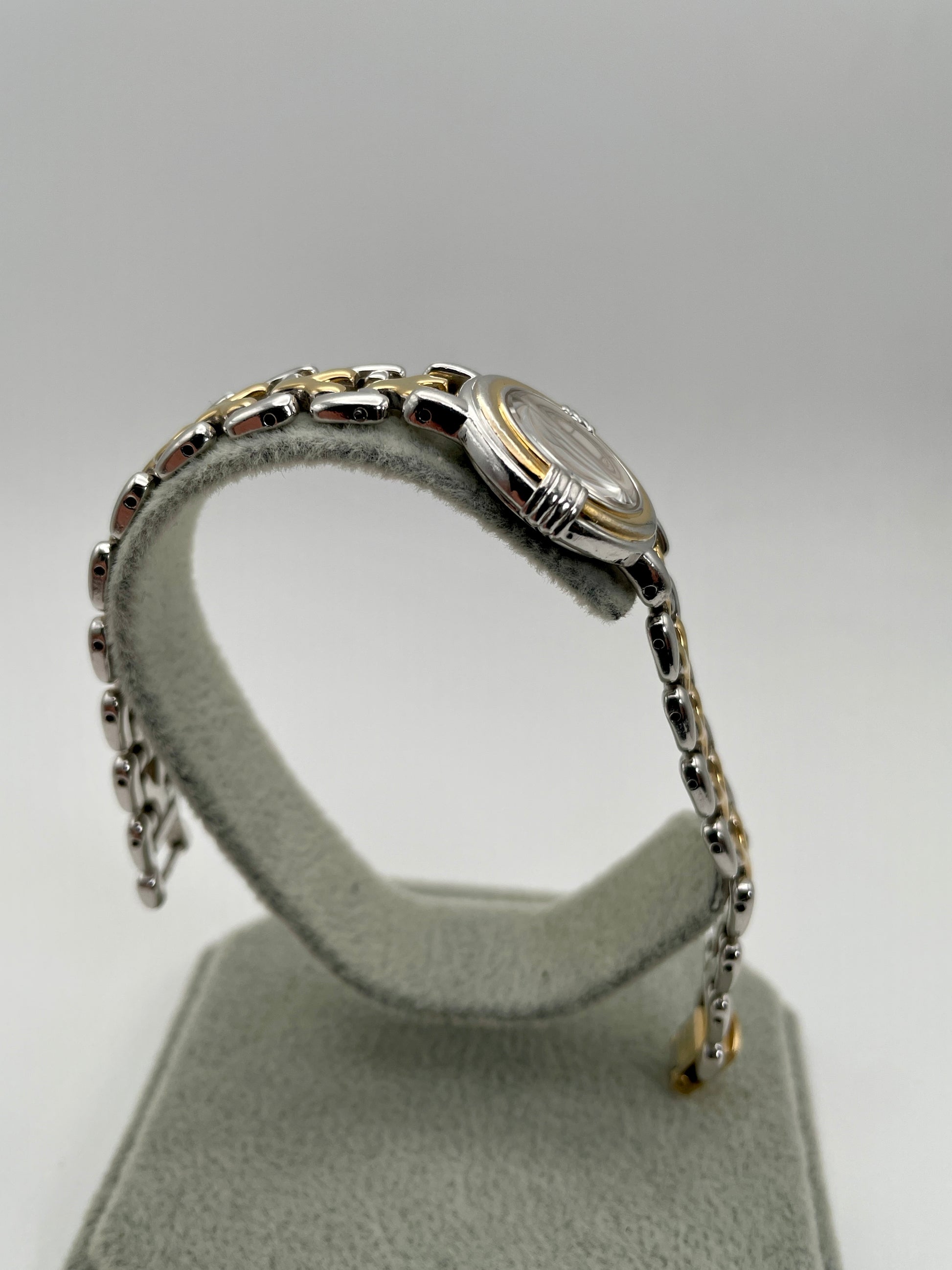 Opposite side view of Yves Saint Laurent vintage women's watch highlighting the slim case and bracelet curve
