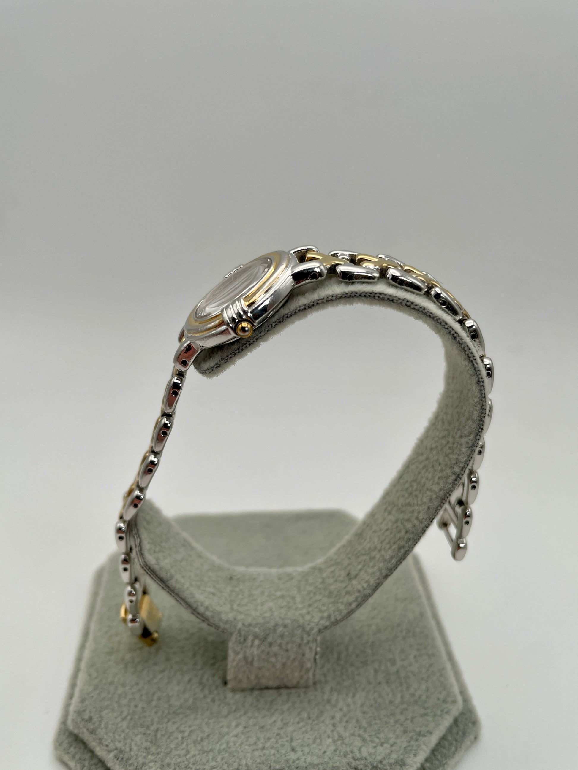 Side view of Yves Saint Laurent vintage women's watch displaying the crown and watch case profile
