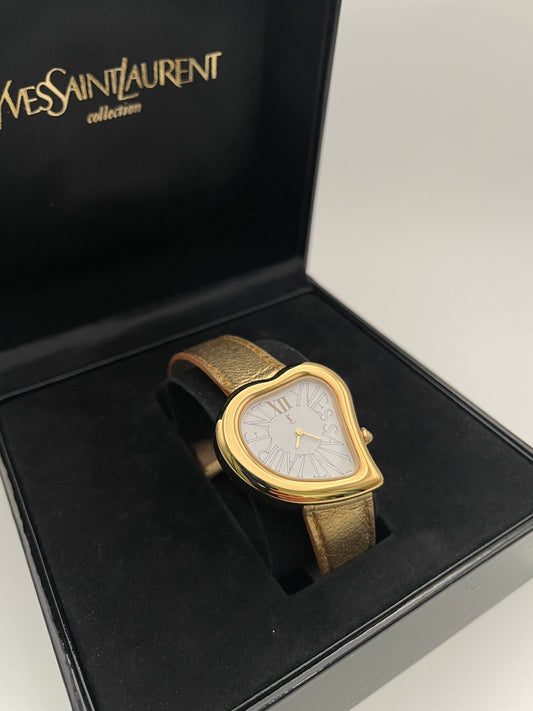 Yves Saint Laurent YSL Heart Watch in medium size with a gold-tone case, white dial, and gold leather strap in original box.